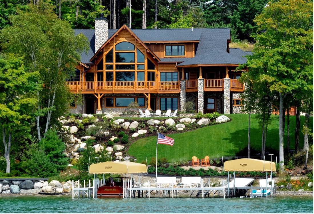 Log home overlooking a boat dock on a lake